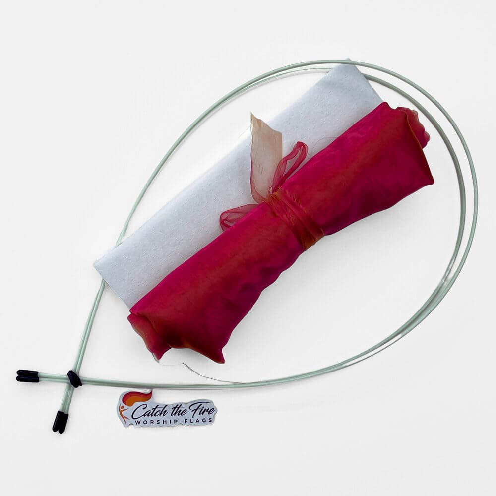 Coral sheer DIY worship flag kit with rolled fabric, pole pocket lining, and flexible quiver poles—symbolizing fellowship, blessing, and our inheritance in Christ.