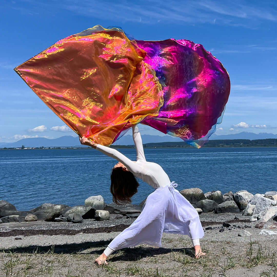 Rainbow shimmer worship flags in motion — triple-layer angel wing design for expressive praise and prophetic dance.