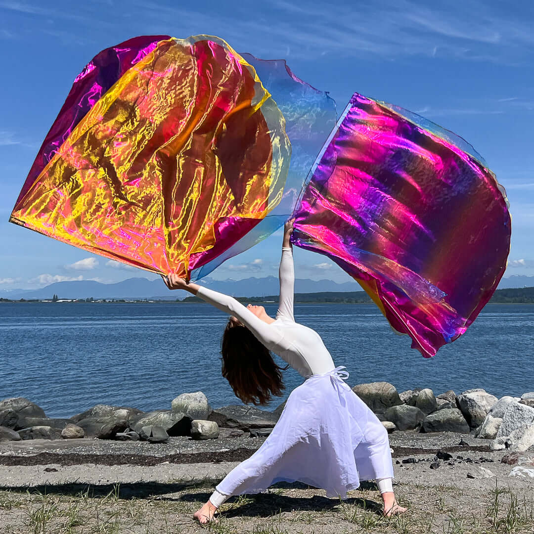 Mourning to Dancing worship flags with pink, yellow, and rainbow tones lifted in joyful, flowing worship movement.