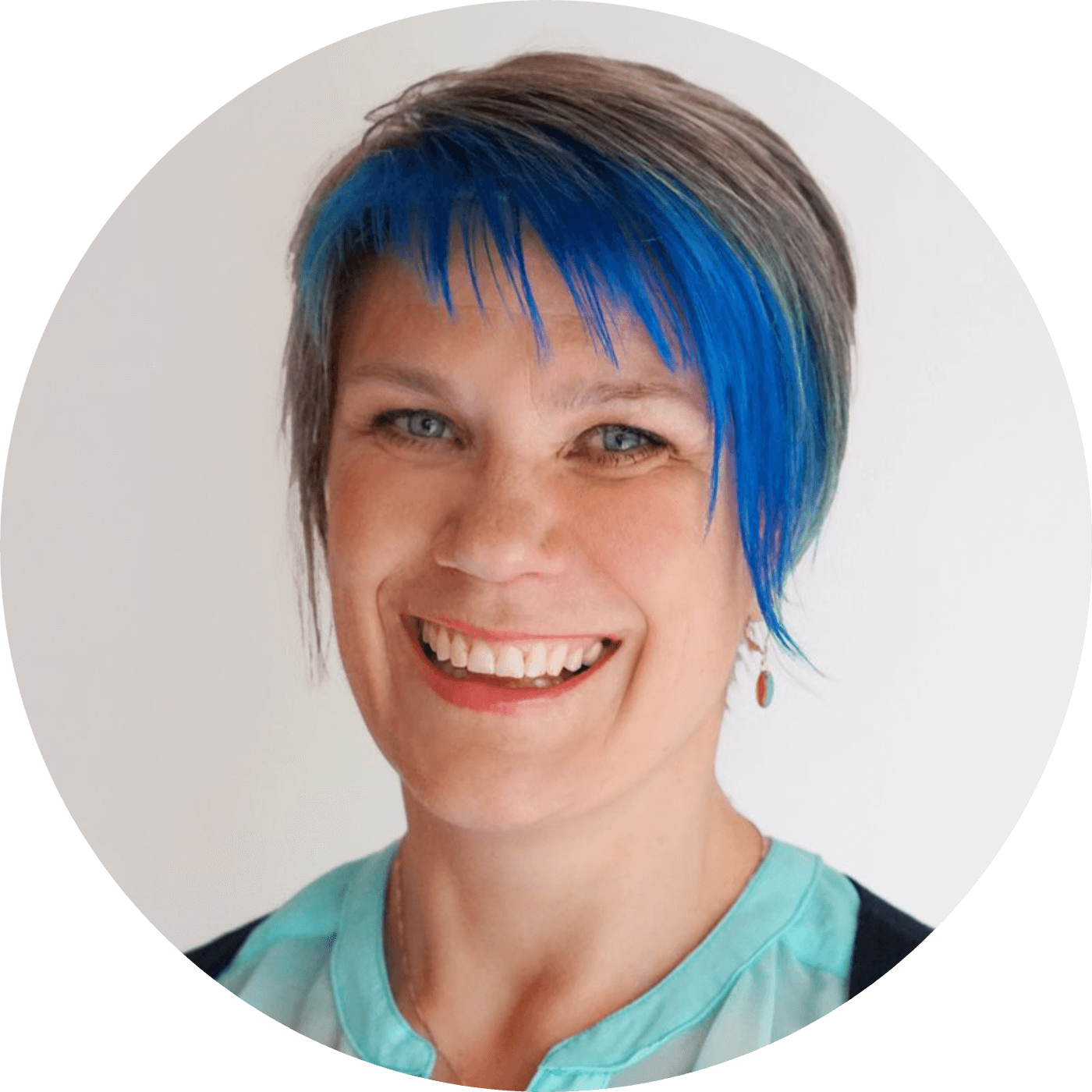 Andrea York, founder of Catch the Fire Worship Flags, smiling in a professional headshot with blue highlights and a joyful presence, passionate about creative Christian worship.