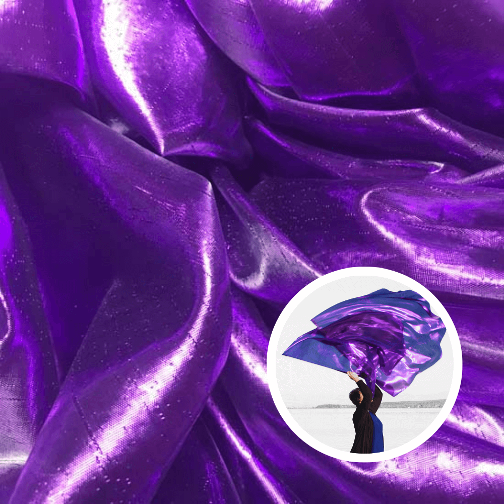 Shimmering purple metallic fabric layered in folds with a dancer holding purple worship flags—symbolizing royalty, intercession, and spiritual authority.
