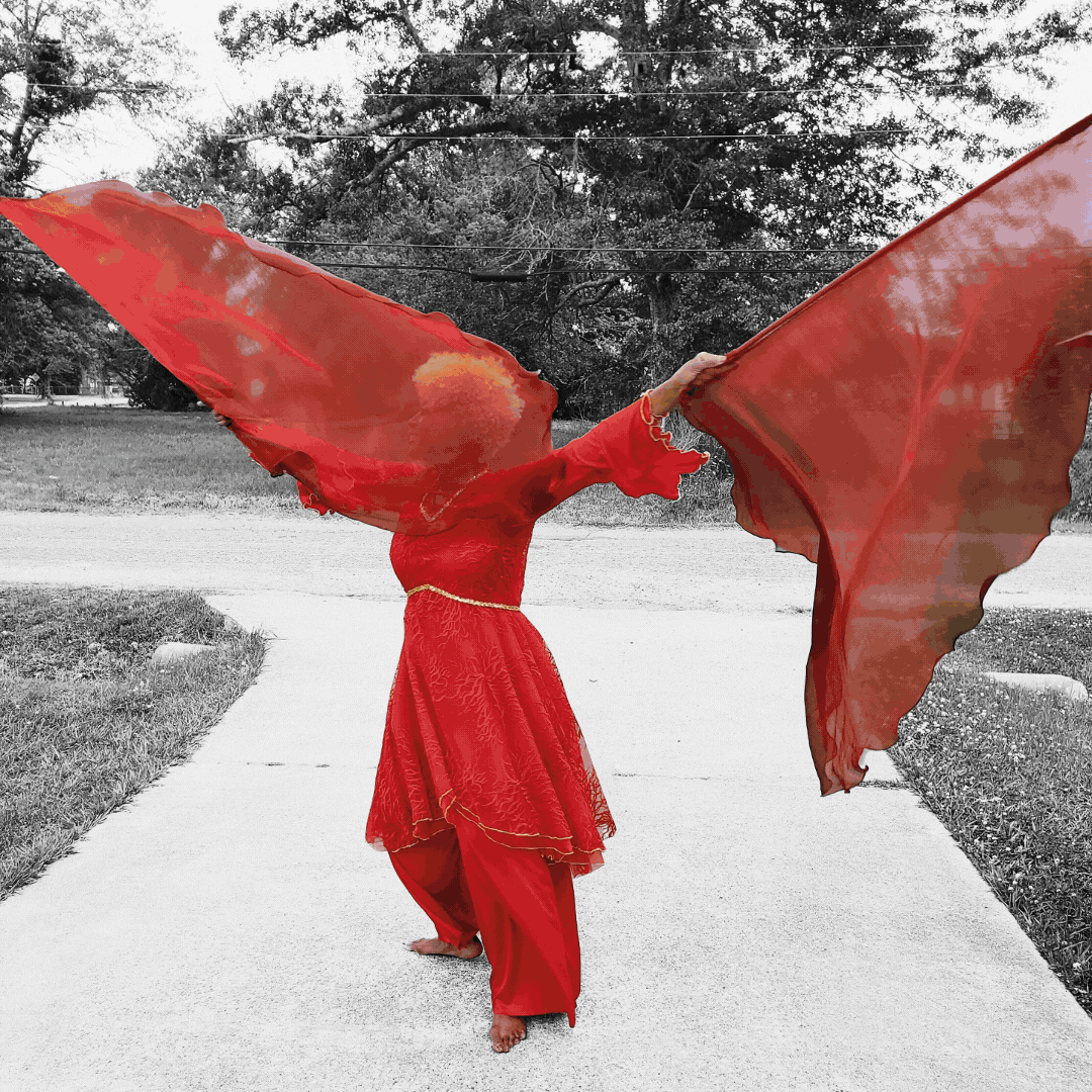 Worship dancer in a praise garments that match colored praise banners symbolizing the biblical meaning of red, orange, yellow, blue, indigo, and purple. A powerful prophetic dance expression in praise and worship.