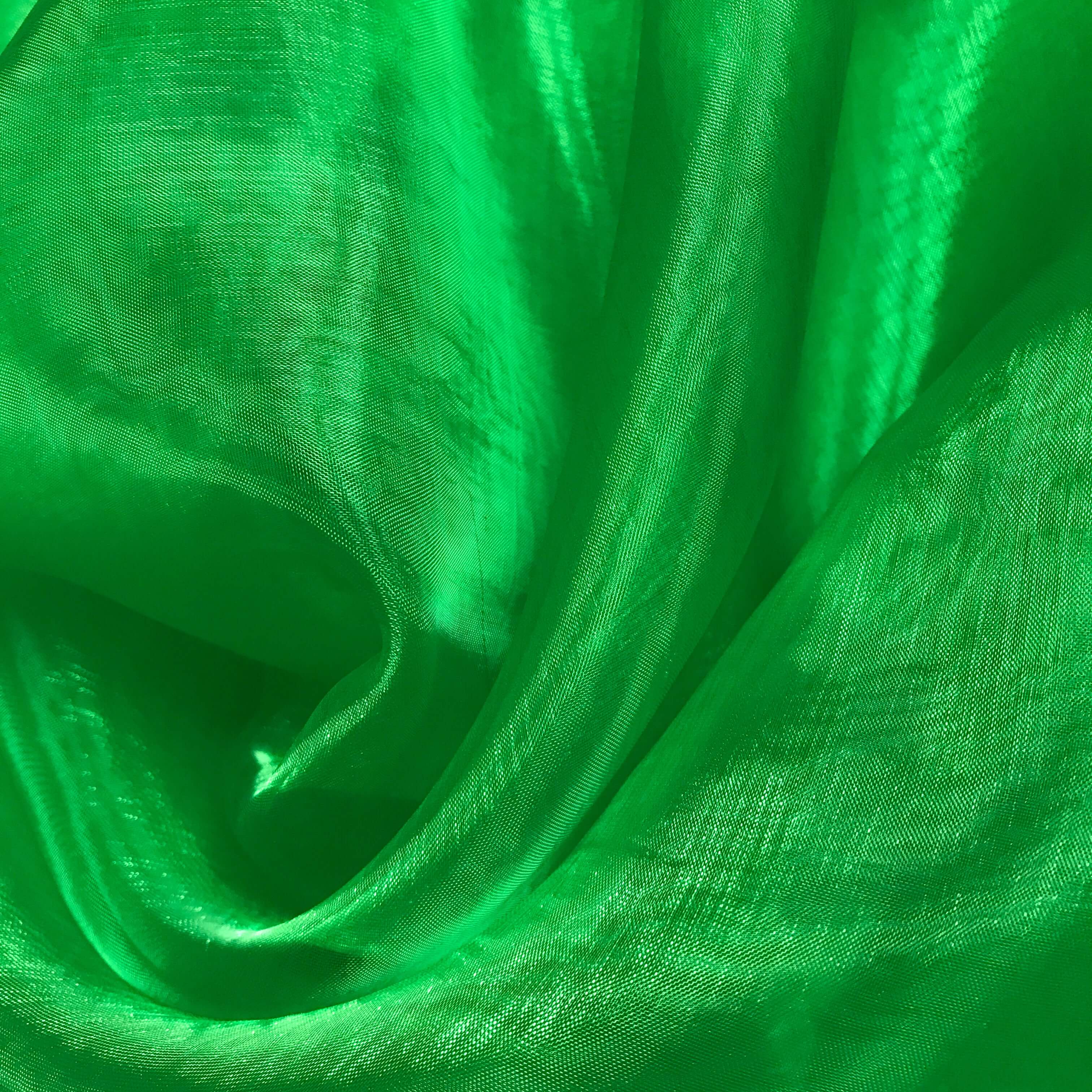 Vibrant green metallic sheer fabric with sheery texture, ideal for worship flags or dance banners—symbolizing new life, growth, and the presence of the Holy Spirit.