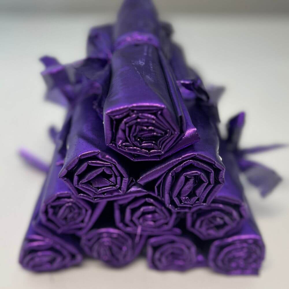 Bundle of 10 purple metallic pre-cut angel wing fabric pairs for DIY worship flags – symbolizing authority, kingship, royalty, and worship.