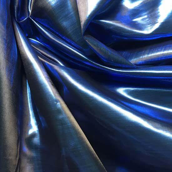 Close-up of metallic sapphire blue worship flag fabric, showcasing its shimmering texture and deep, heavenly color.