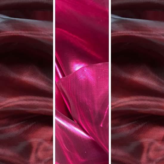 Close-up of layered worship flag fabrics in deep wine and vibrant scarlet pink hues, showcasing sheer shimmer, fluid texture, and rich biblical color symbolism.
