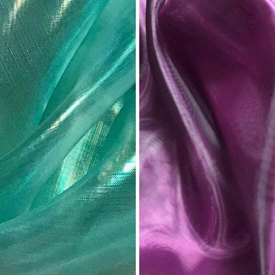 Close-up of sheer iridescent fabric in two colors—teal green on the left and rich purple on the right—highlighting the shimmer and texture of the worship flag materials.
