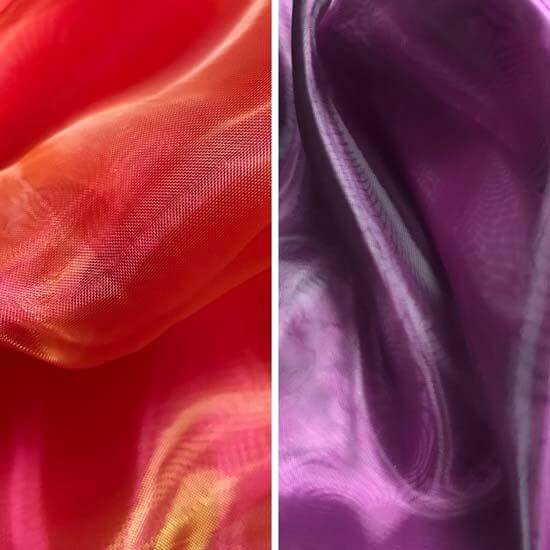 Side-by-side close-up of red-orange (scarlet) and purple shimmer fabric, used for worship flags in dance and expressive movement.