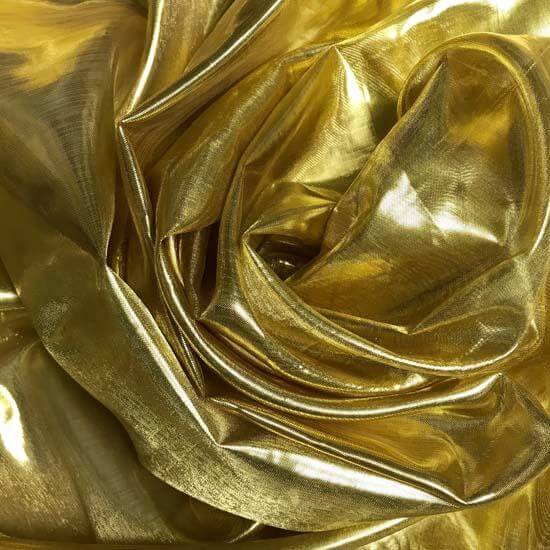 Close-up of metallic gold worship flag fabric, capturing its radiant texture and luxurious folds for vibrant praise and prophetic movement.