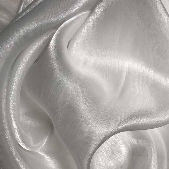 Close-up of flowing white shimmer fabric with soft sheen, ideal for worship flags or praise garments symbolizing holiness and surrender.