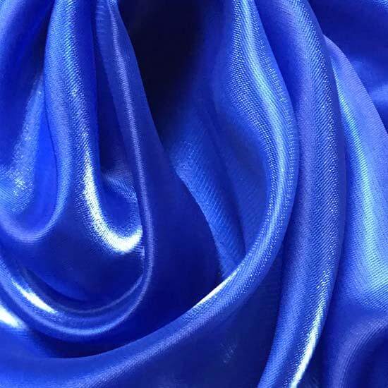 Close-up of blue shimmer fabric with a glossy finish, ideal for biblical meaning representing grace, prophecy, and the throne of God