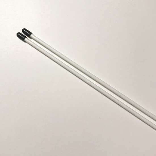 Pair of white Flexion flag poles with black end caps, designed for worship flagging and dance movement.
