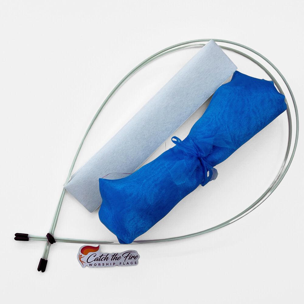 Light blue worship flag travel kit with sheer rolled fabric, white sleeve, and flexible Flexion rods, displayed with Catch the Fire Worship Flags logo.