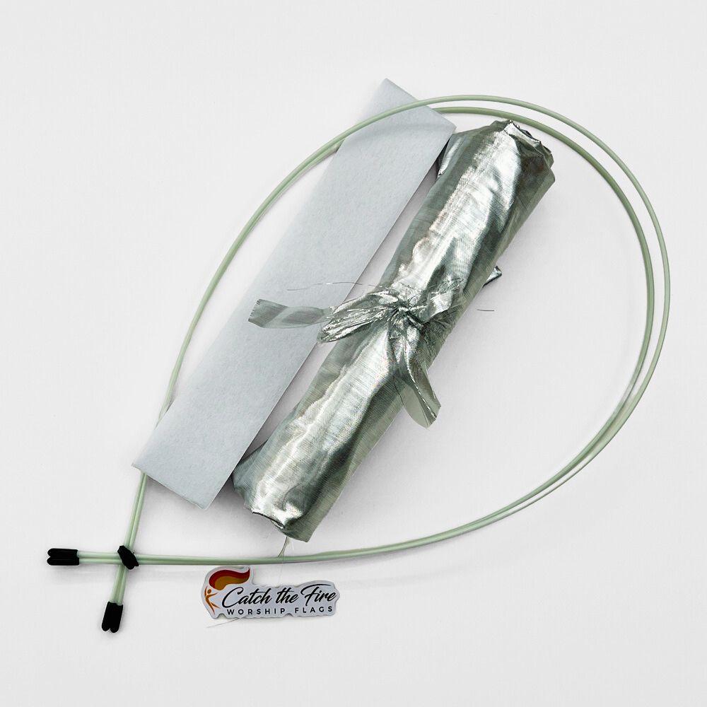 Silver metallic DIY worship flag kit with pre-cut fabric, pole pocket lining, and flexible quiver poles—symbolizing redemption, wisdom, and refinement.