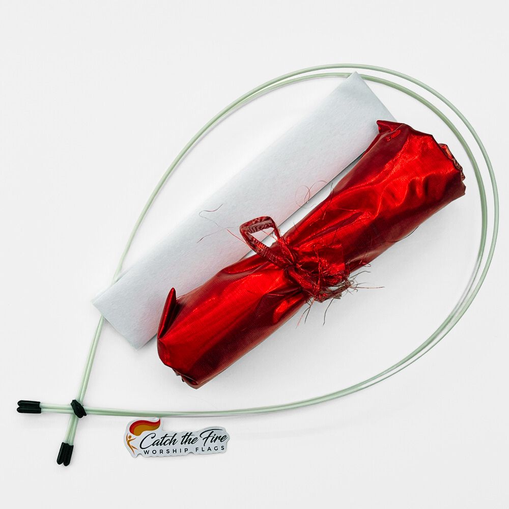 Compact red worship flag travel kit with shimmer fabric, white storage sleeve, flexible poles, and Catch the Fire Worship Flags logo.