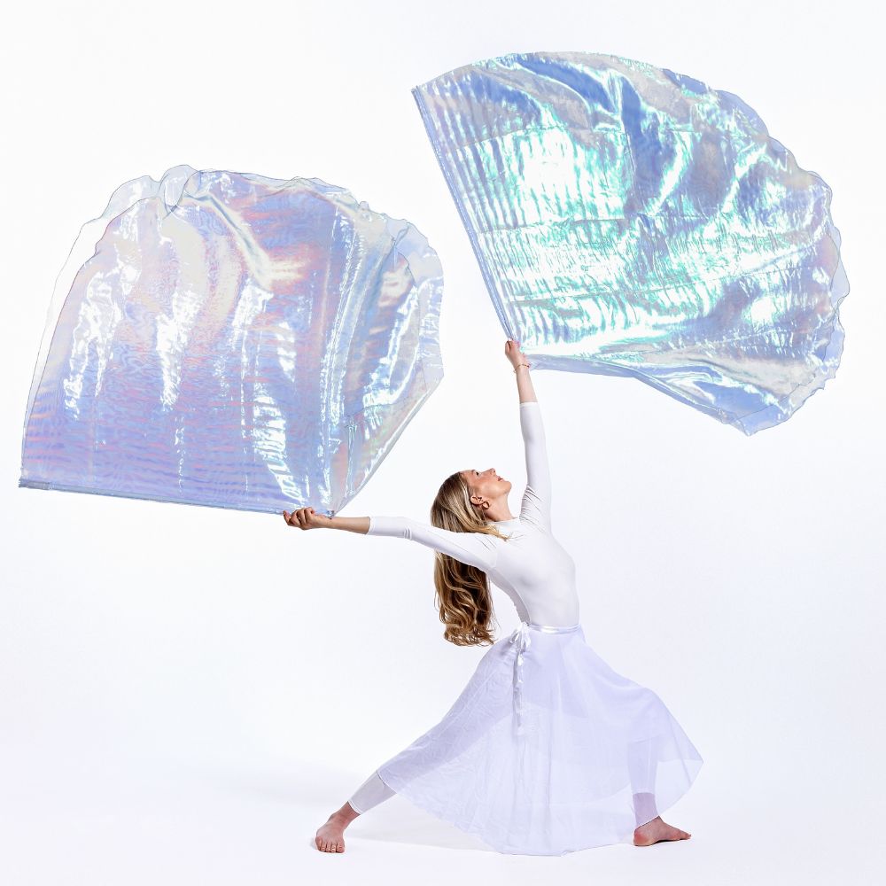 Holy & Blameless iridescent worship flags raised in stillness, showing double-layer design. A visual declaration of holiness and anointing through prophetic movement.