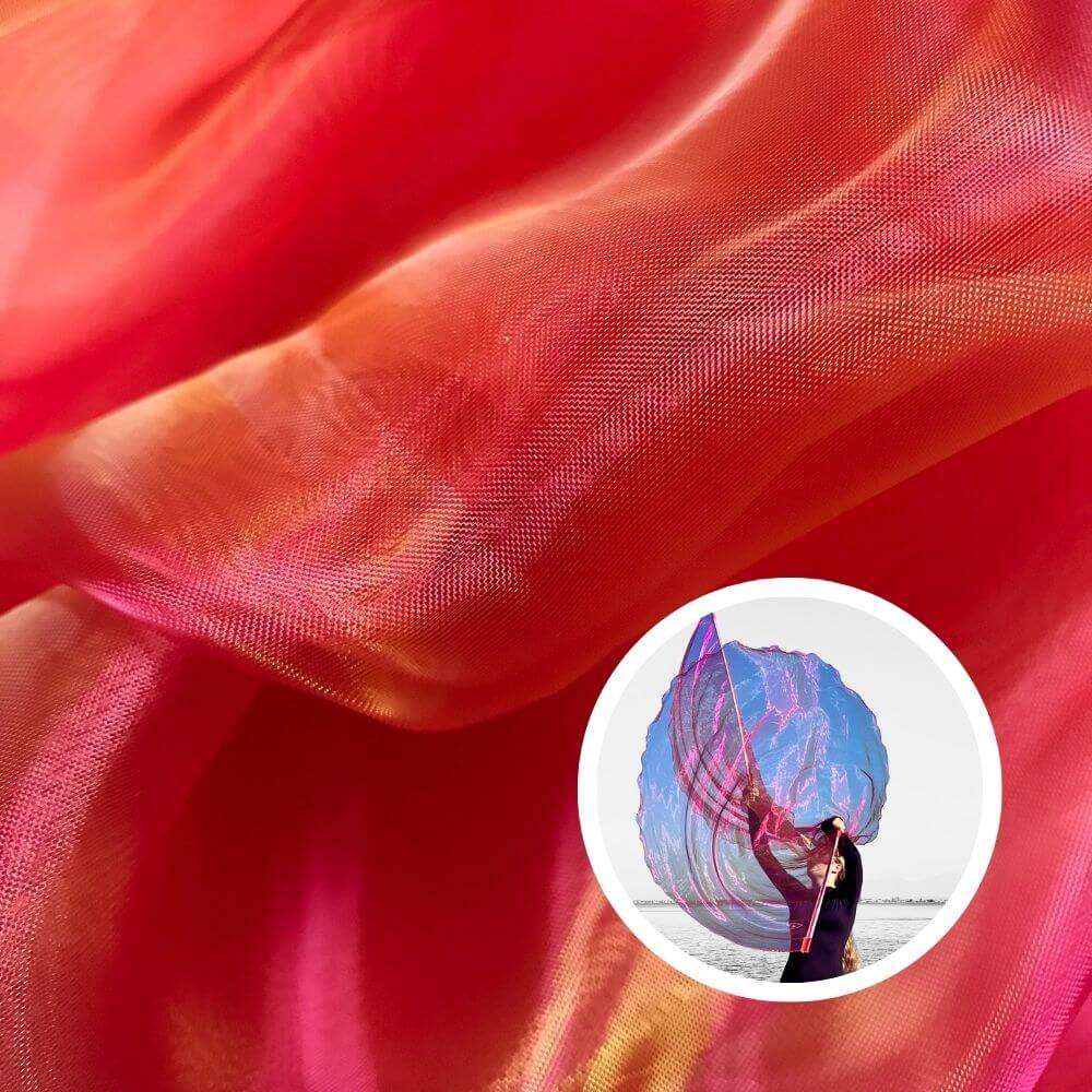  Flowing coral and pink shimmer fabric with inset of dancer holding worship flags by the water, symbolizing joy, intimacy, and passionate praise.