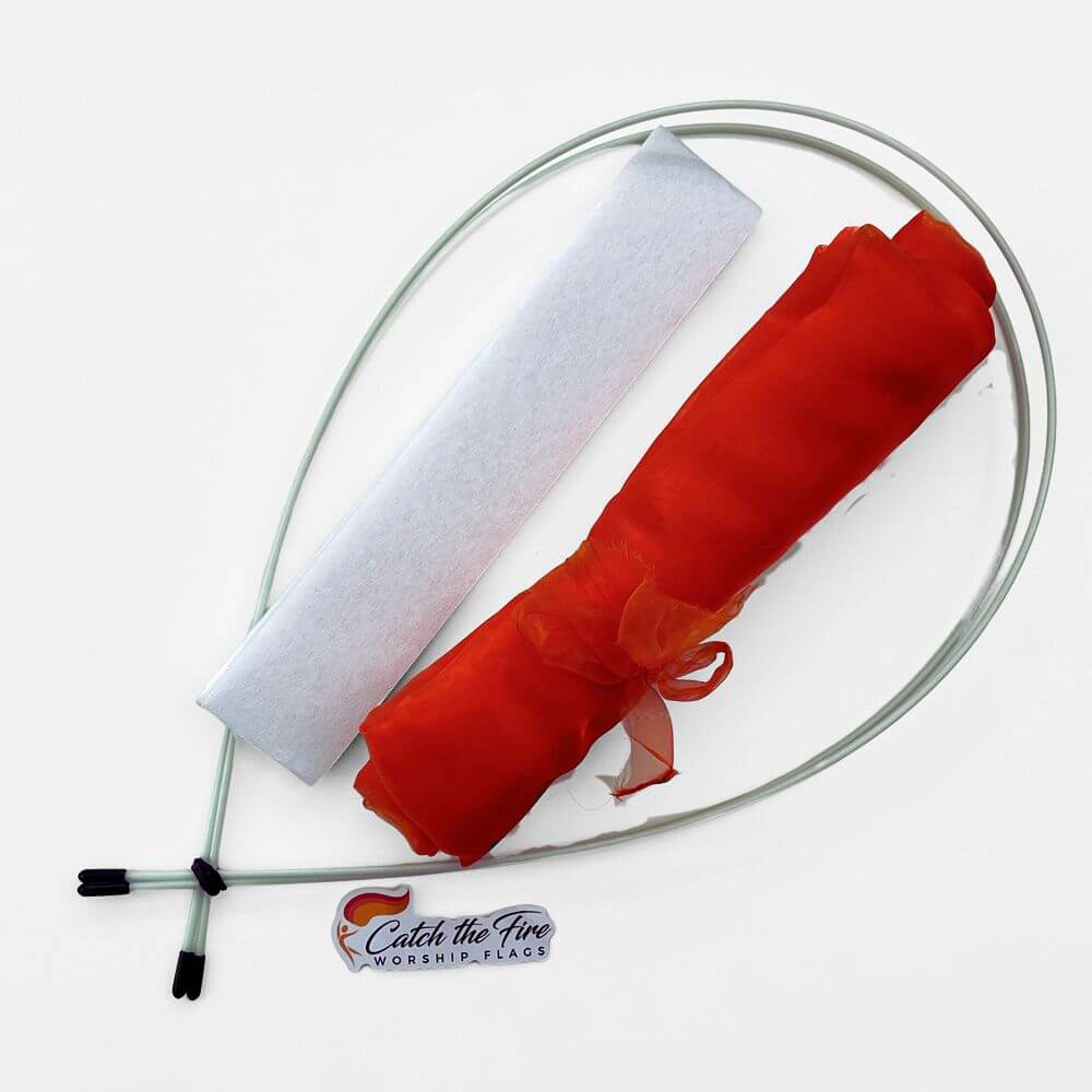 DIY worship flag kit from Catch the Fire Worship Flags featuring sheer red-orange fabric, clear flex rods, and protective storage sleeve.