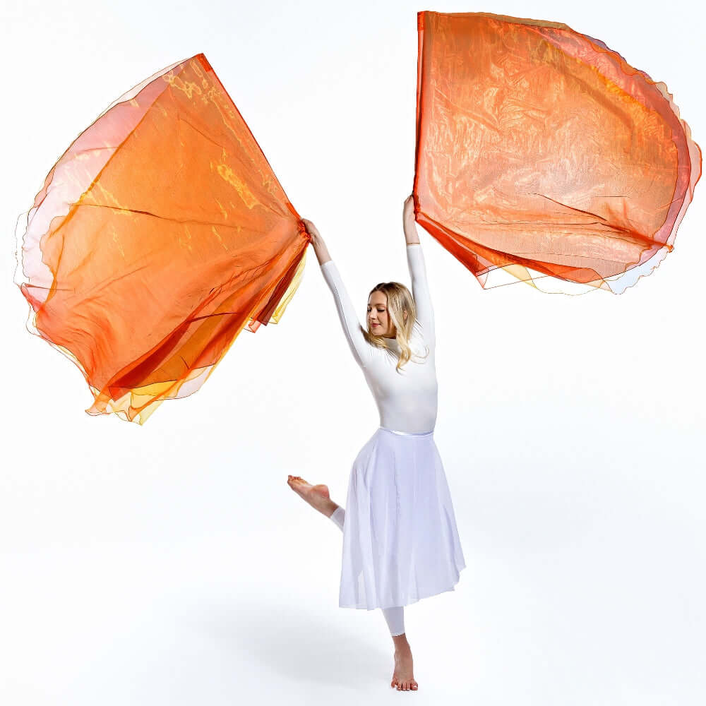 Worship dancer moves gracefully with Fan Into Flame triple-layer flags, lifting a visual flame of praise in movement and devotion.