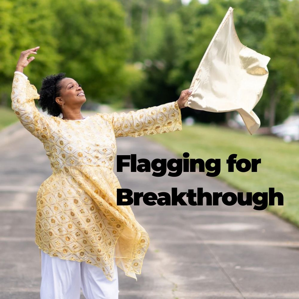 A woman outdoors on a paved path wearing a flowing beige and gold patterned tunic with white pants, holding a matching beige fabric. Large black text reads 'Flagging for Breakthrough' across the center.